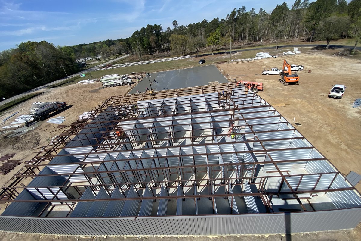 Aerial view of self-storage facility under construction during steel erection and concrete pour