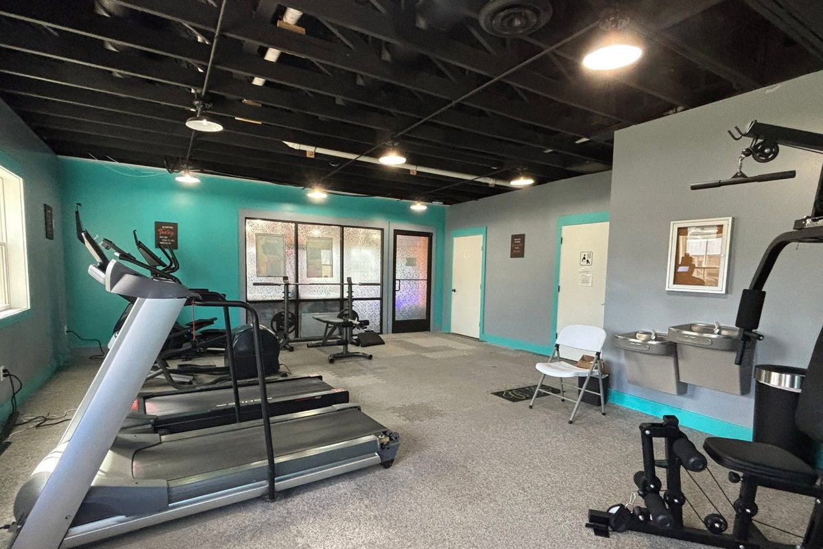 Fitness facility interior with exposed steel structure