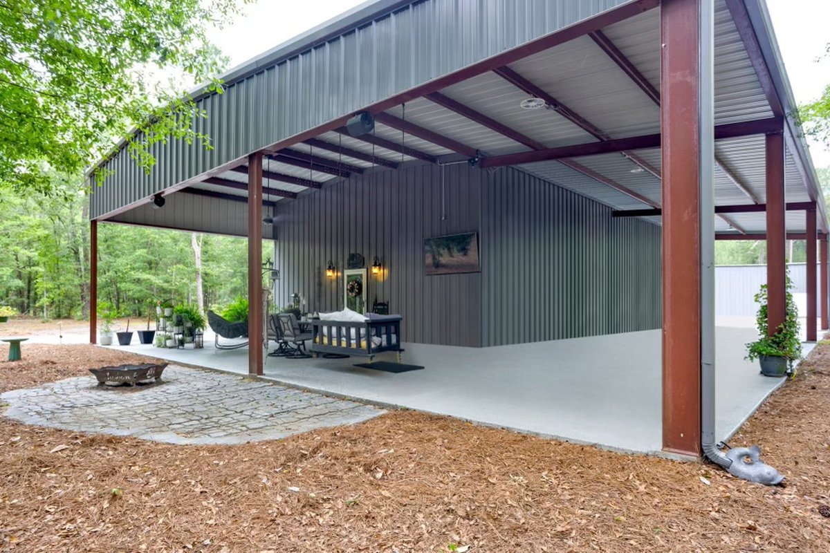 Covered outdoor pavilion with concrete patio and fire pit