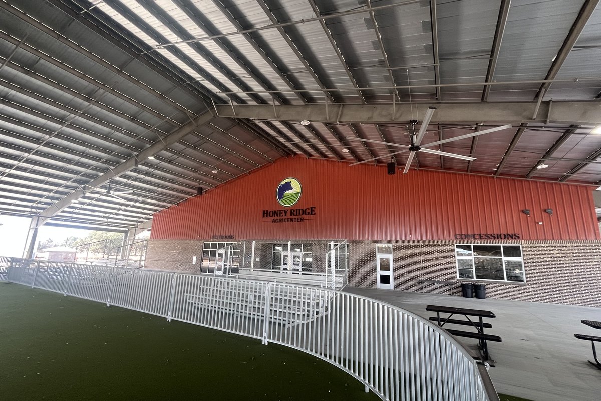 Honey Ridge Agricenter covered arena interior with concessions and seating